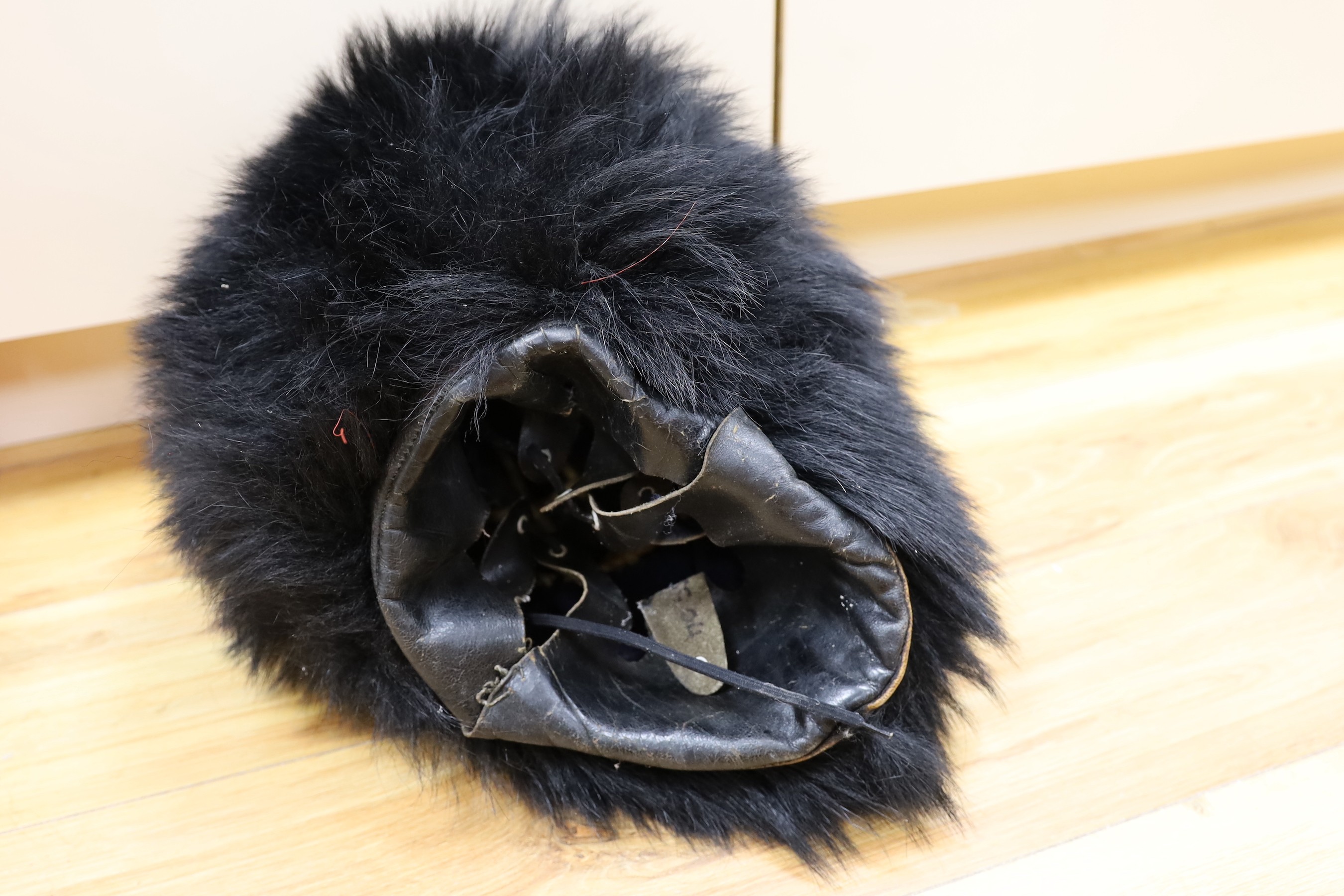 A Royal Horseguard's helmet and Queen’s guard bearskin